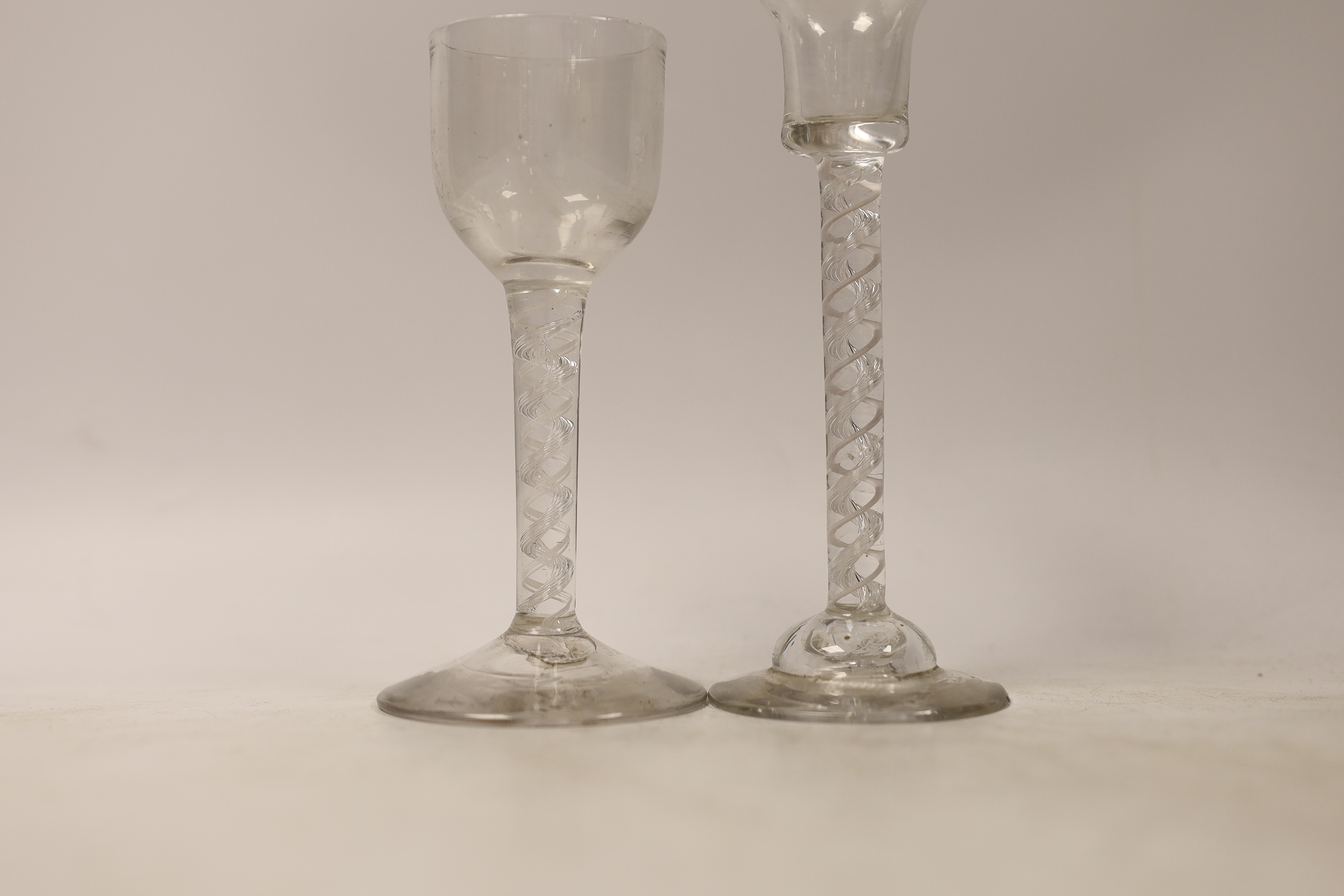 Two George II double series mixed twist cordial glasses, one with domed foot, tallest 16cm